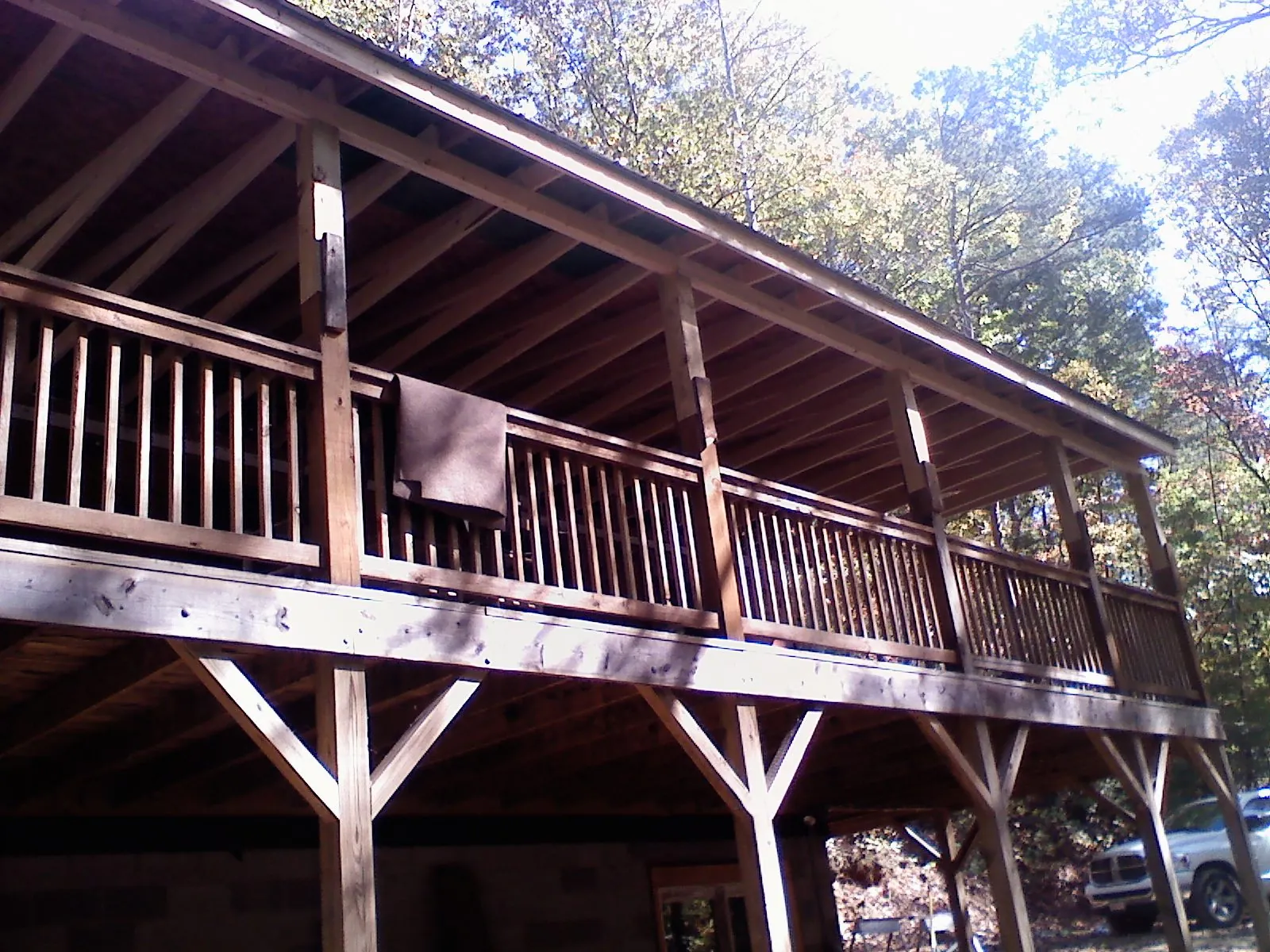Timber framing under a new elevated porch and deck — Roof Leak Repair in Manito by Roofing Brothers